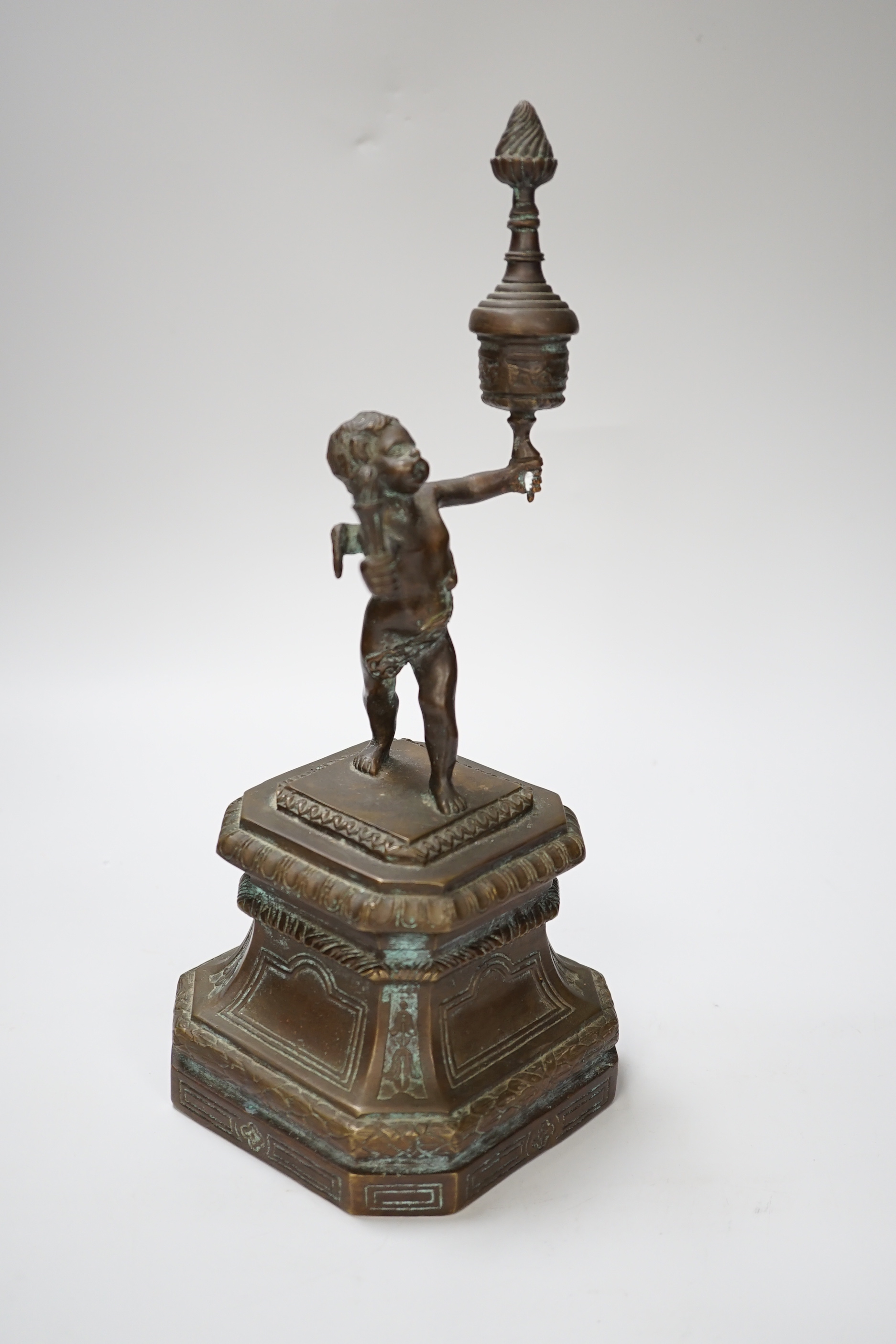 A bronze figure of a cherub, 30cm